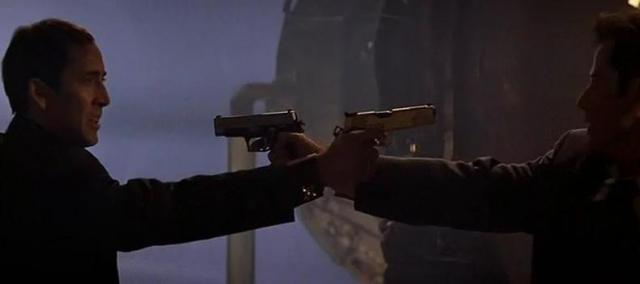 Two guys Face off with guns.jpg