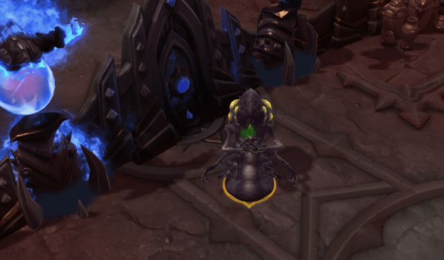 An alien creature sits and plots behind a gate