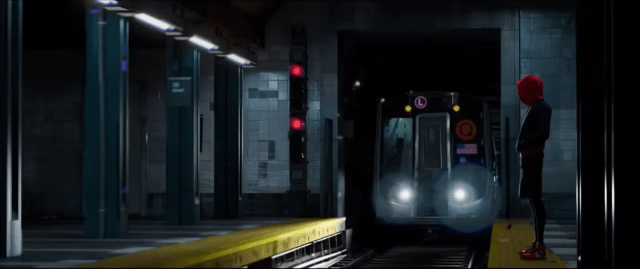 Miles, in red hoodie, stands on the subway platform as the train comes in
